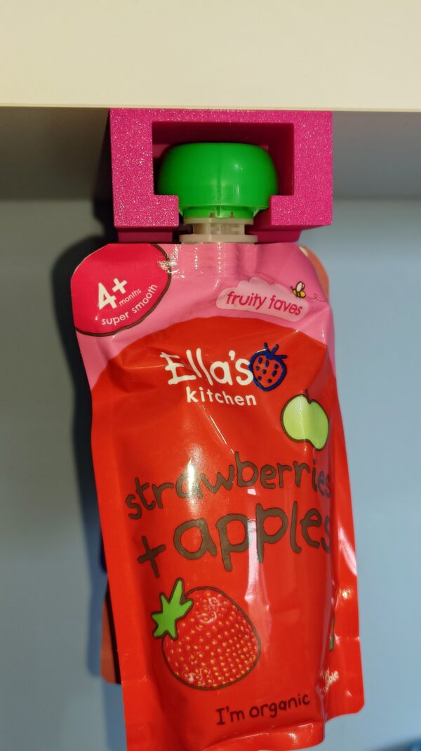 Double-sided tape mounted 3D printed pouch holder for children’s food pouches