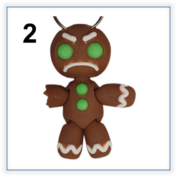 #2 3D printed traditional gingerbread man keyring with an unhappy face and broken arm