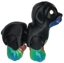 Rottweiler print side image A 3D-printed figure of a Rottweiler standing upright, showing its characteristic black and tan markings, stocky build, and distinct facial details.