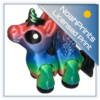A 3D-printed articulated alicorn hatchling figure with flexible, segmented joints, small feathered wings, and a tiny spiraled horn, resting upright on a flat surface.