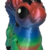 A 3D-printed articulated alicorn hatchling figure with flexible, segmented joints, small feathered wings, and a tiny spiraled horn, resting upright on a flat surface.
